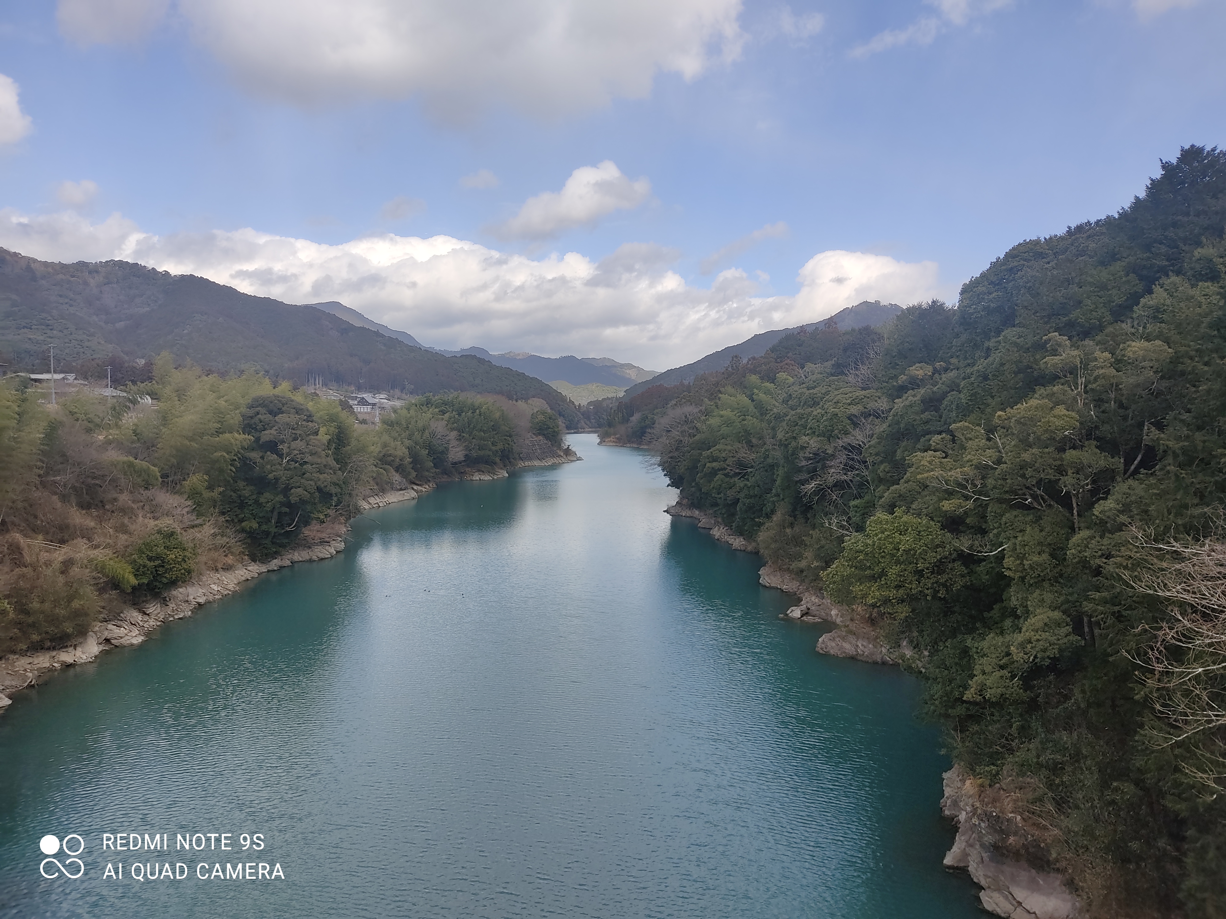 Blue river, an aerial view of a river surrounded by mountains